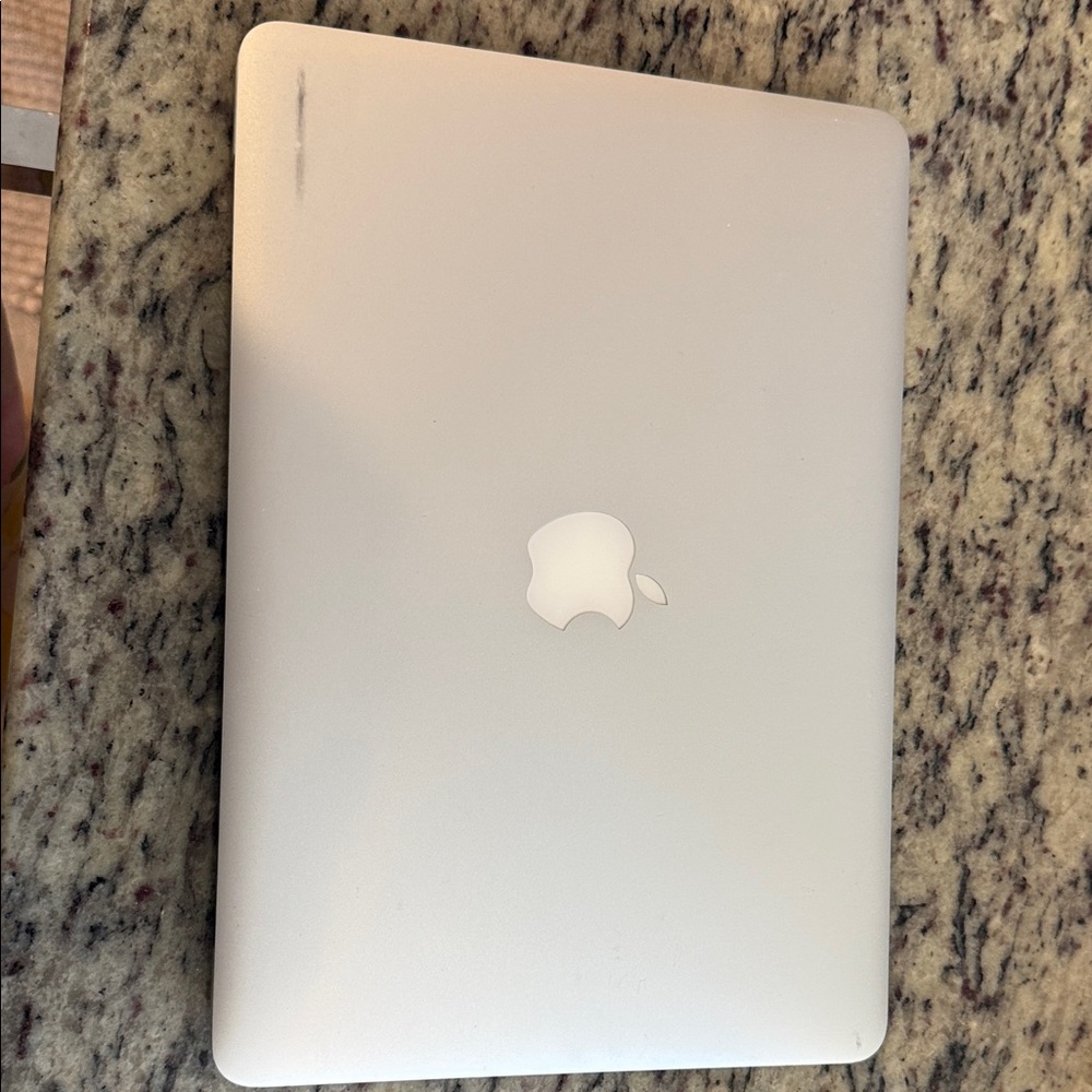 Apple Silver MacBook Closed Laptop with Centered Apple Logo